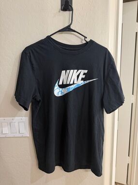 Nike Black Tee with White Logo and Blue Patterned Swoosh